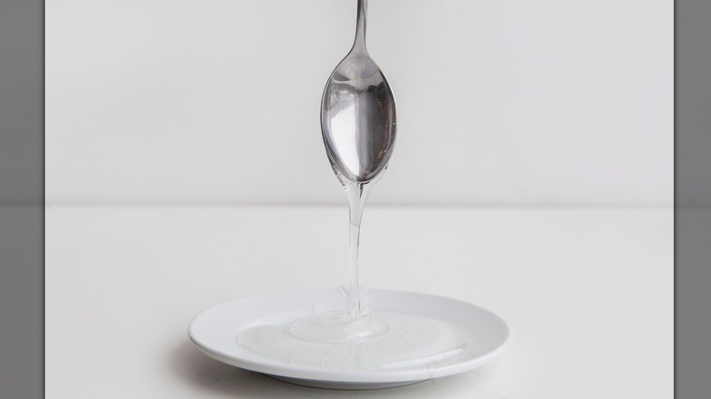 Spoon with liquid syrup