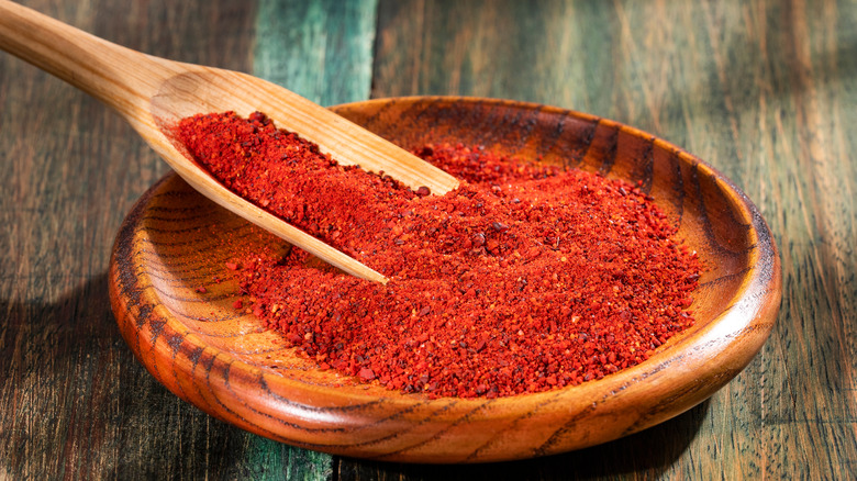 Annatto seed powder in bowl 