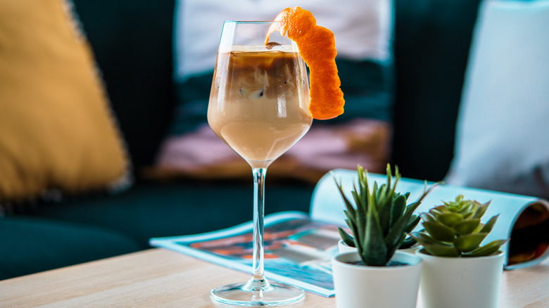 Coffee cocktail with orange garnish