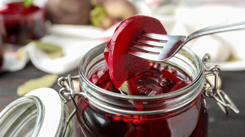 Close up of sliced beets on fork