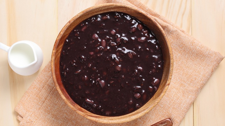 Top-down view of a bowl of black bean soup