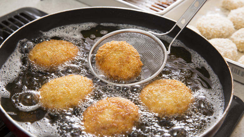 frying croquettes in skillet