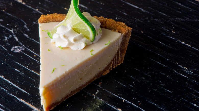 slice of key lime pie with lime decoration