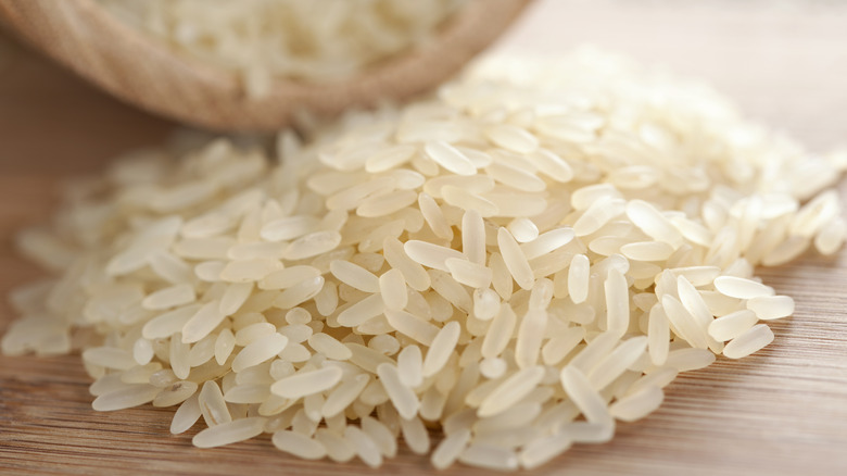 uncooked rice on wooden table