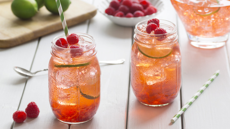 Raspberry iced tea cocktail with mint in mason jars