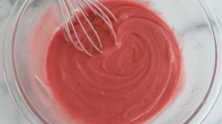pink batter in clear bowl