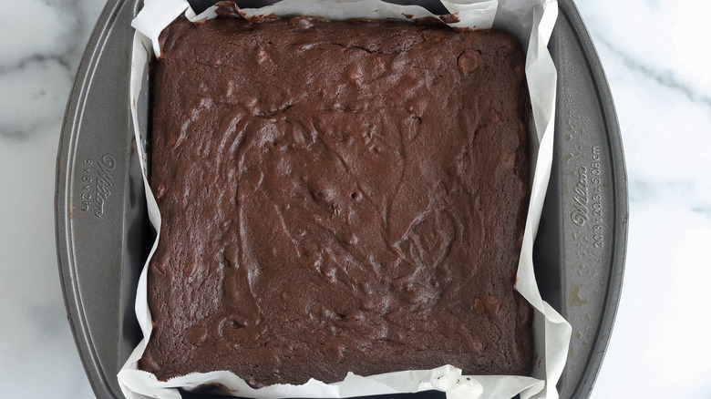brownies in paper-lined pan