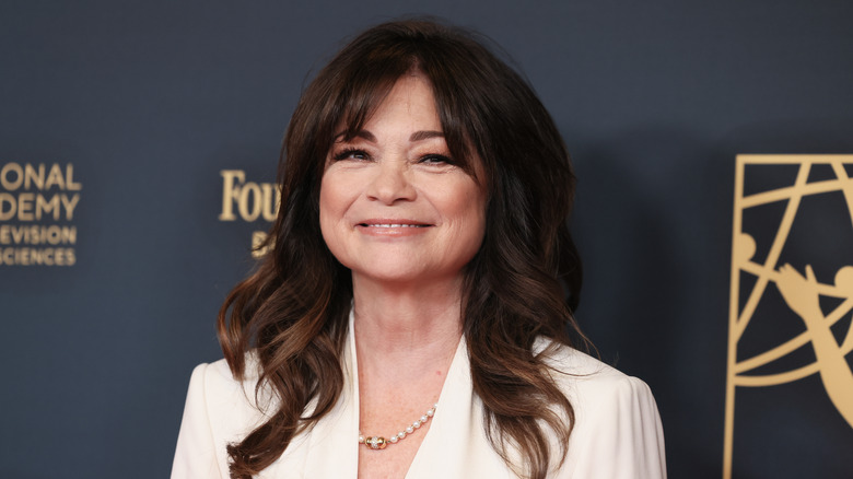 Valerie Bertinelli smiles in white blazer