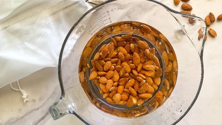 almonds soaking in glass bowl