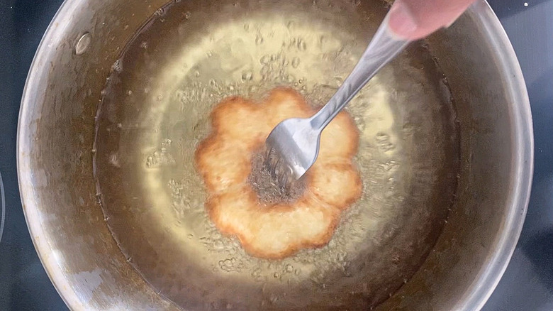 ring-shaped donut frying 