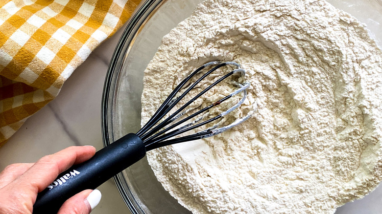 whisking flour in bowl