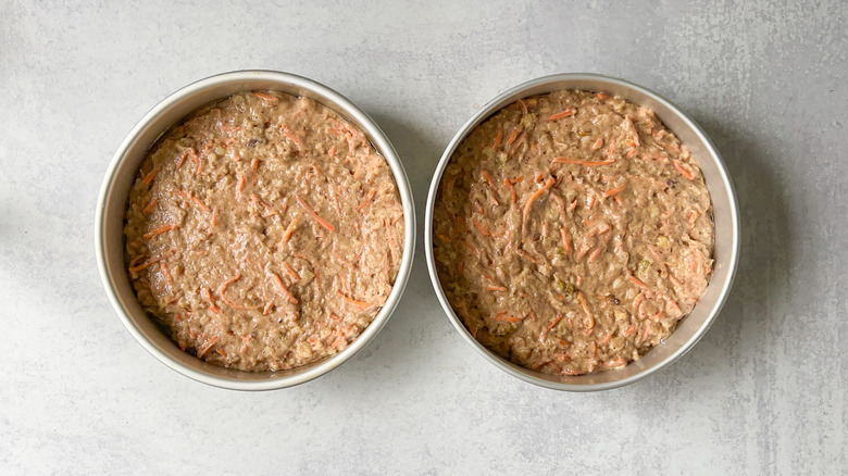 Vegan carrot cake batter in round cake pans