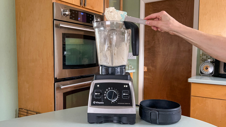 Processing cashews into a paste in blender