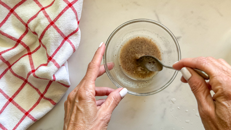 hands mixing flax egg