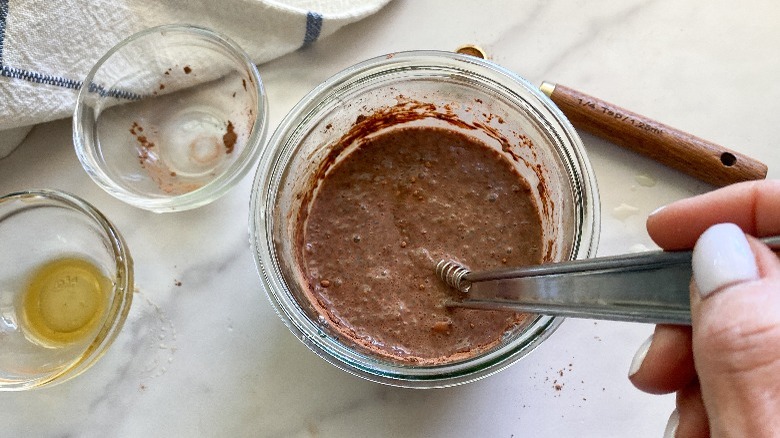 stirring chocolate in the chia seed pudding