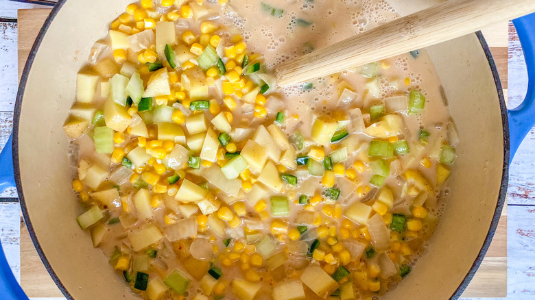 liquid and veggies in pot 