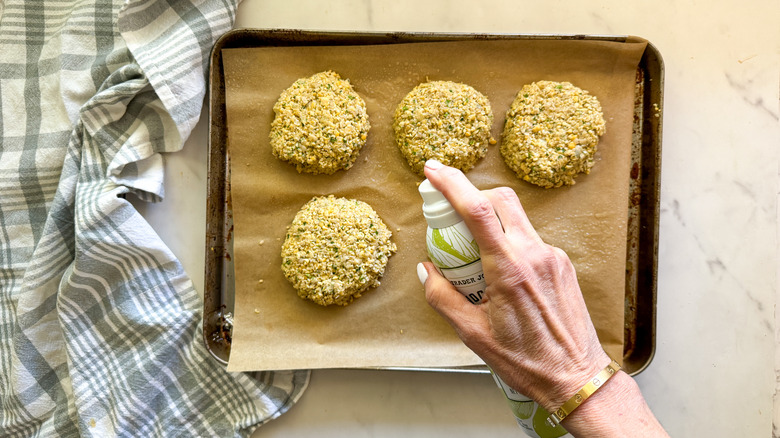 spraying patties with cooking spray