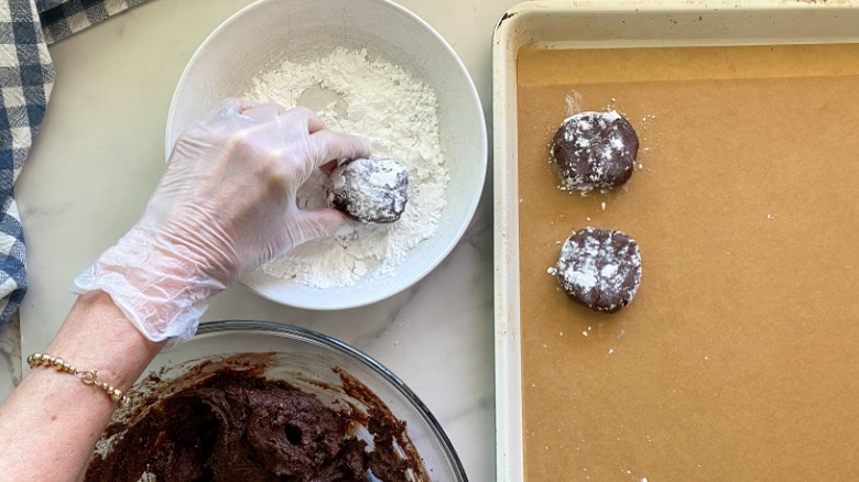 rolling cookie dough in sugar