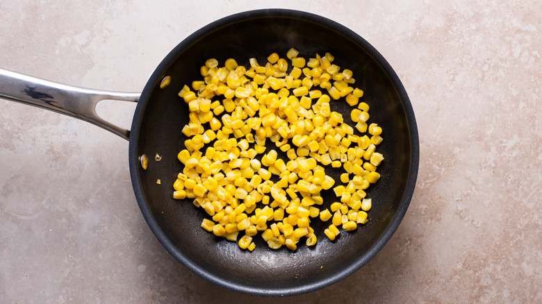 cooked corn in a skillet