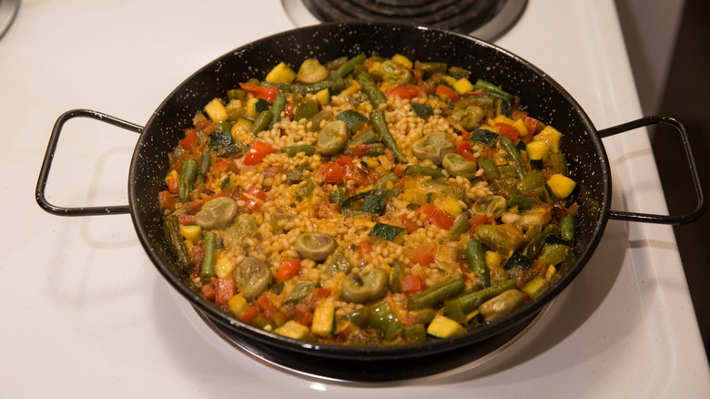 paella cooking in paella pan