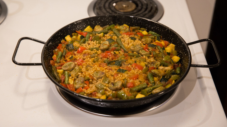 paella cooking on stovetop 