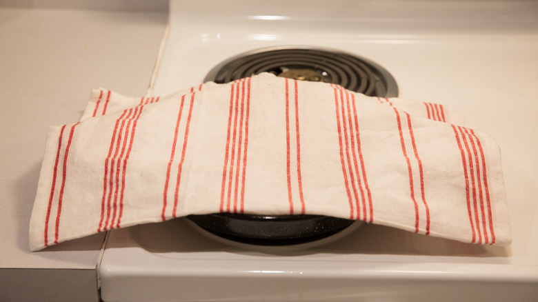 paella pan covered with towel 