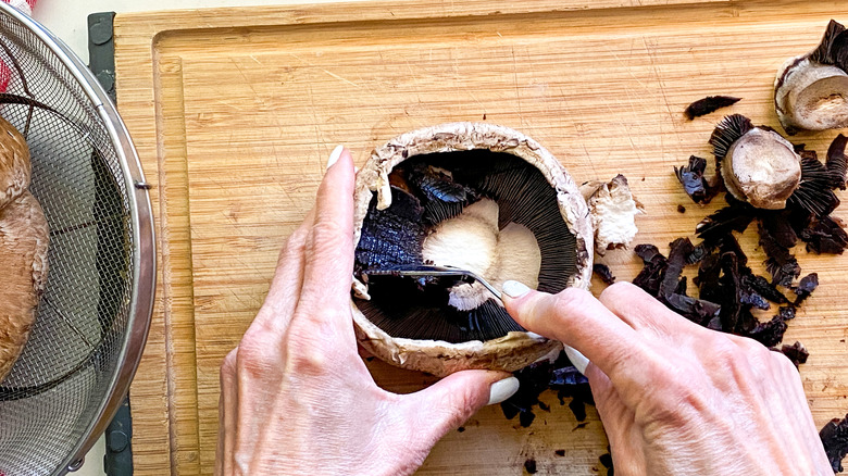 spoon removing mushroom gills