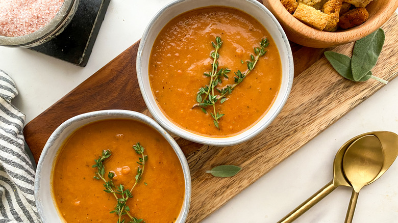 2 bowls of soup with garnish