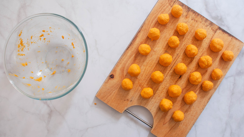 Balls of sweet potato dough ready to be fried