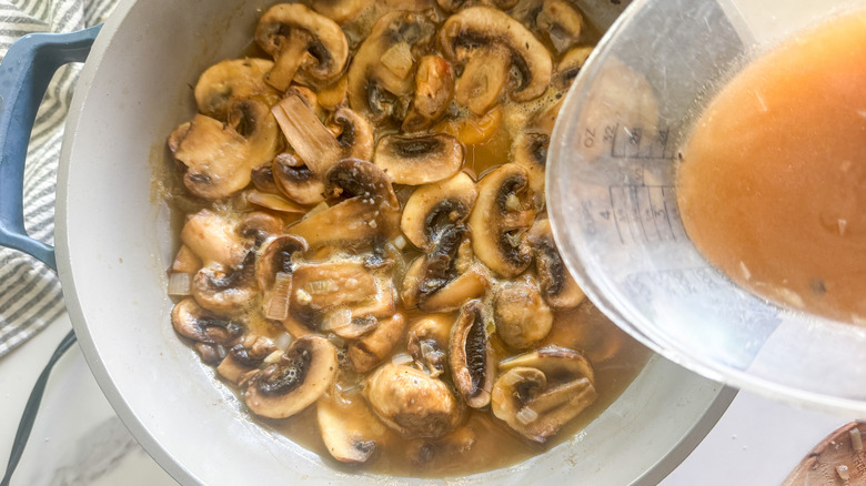 Broth pouring into a pan