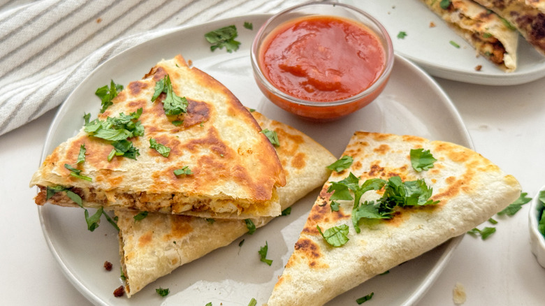 sliced quesadilla on plate