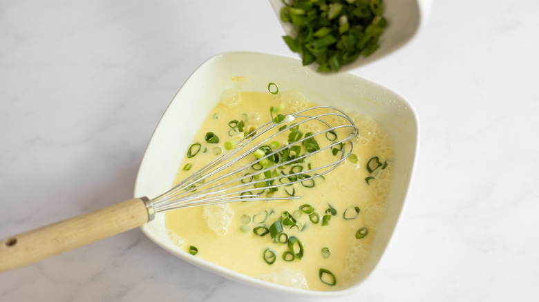 adding green onions to batter