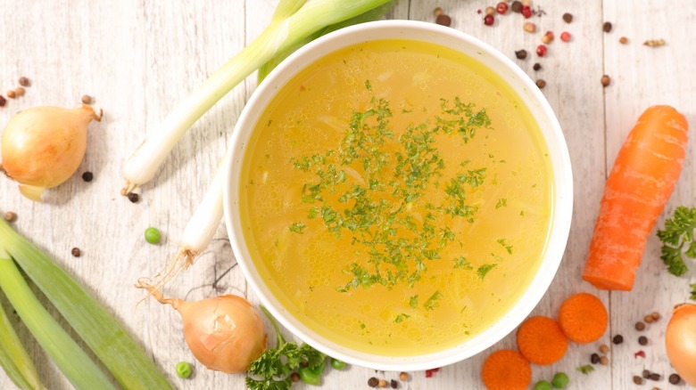 Vegetable broth in white bowl