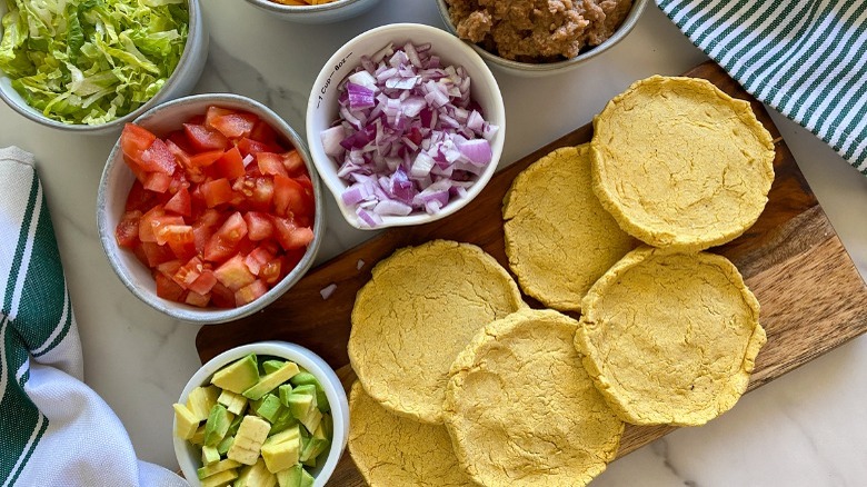 sopes with bowls of toppings