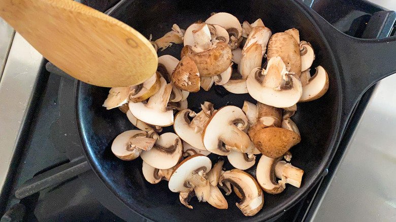 cooking mushrooms in pan