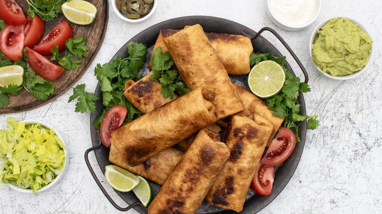 vegetarian chimichangas with toppings and sides