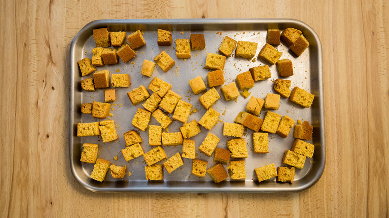 baked cornbread cubes in pan