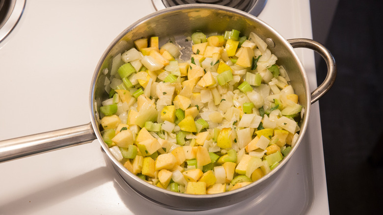 vegetables cooking in large skillet