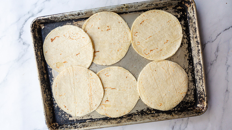 Tortillas on baking sheet