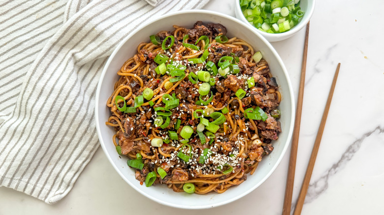 dan dan noodles in white bowl