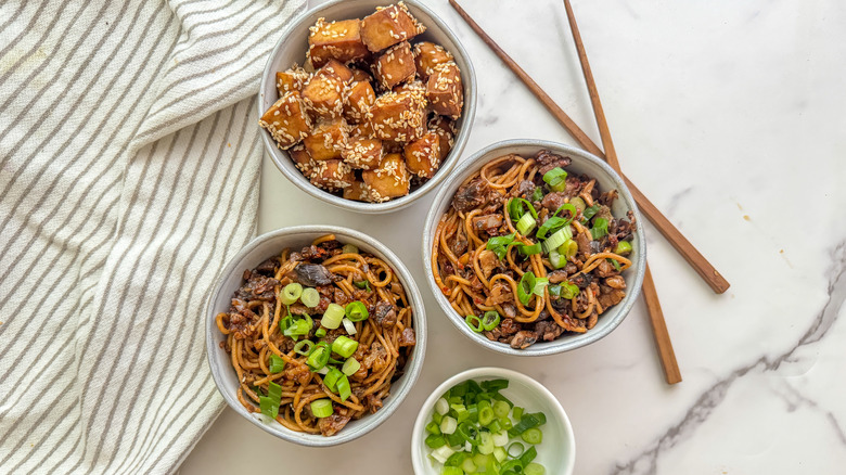 bowls of noodles and tofu