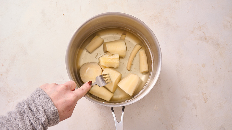 poking parsnips with a fork