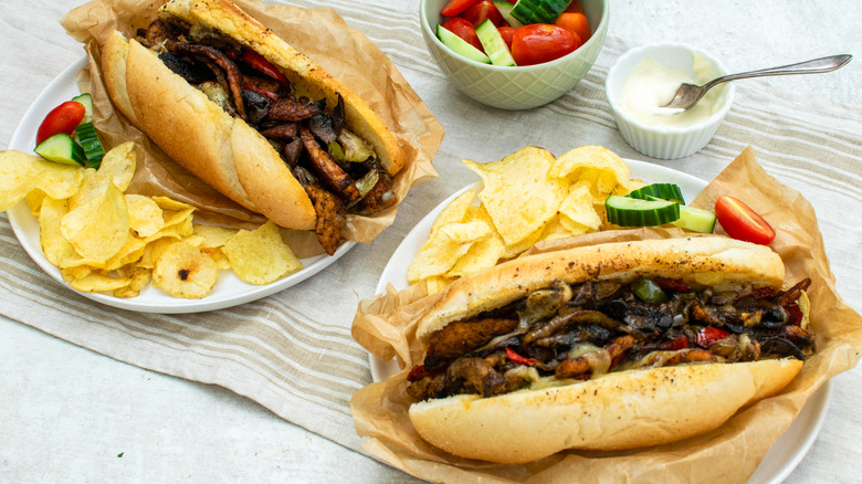 Cheesesteak on plate with chips