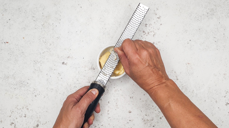 Grating garlic for garlic butter