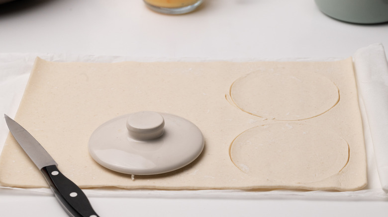 cutting out puff pastry lids