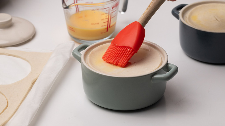 brushing pastry with egg wash 