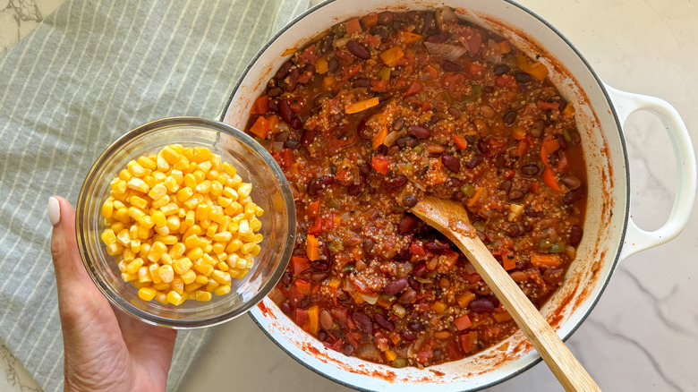 adding corn to pot