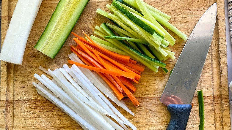 sliced veggies on board