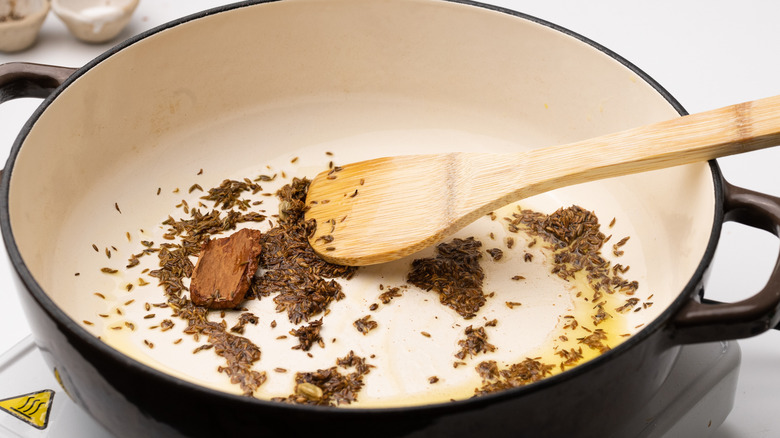 spices blooming in oil 