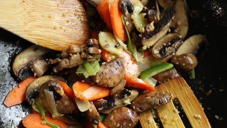 mushrooms and veggies in pan